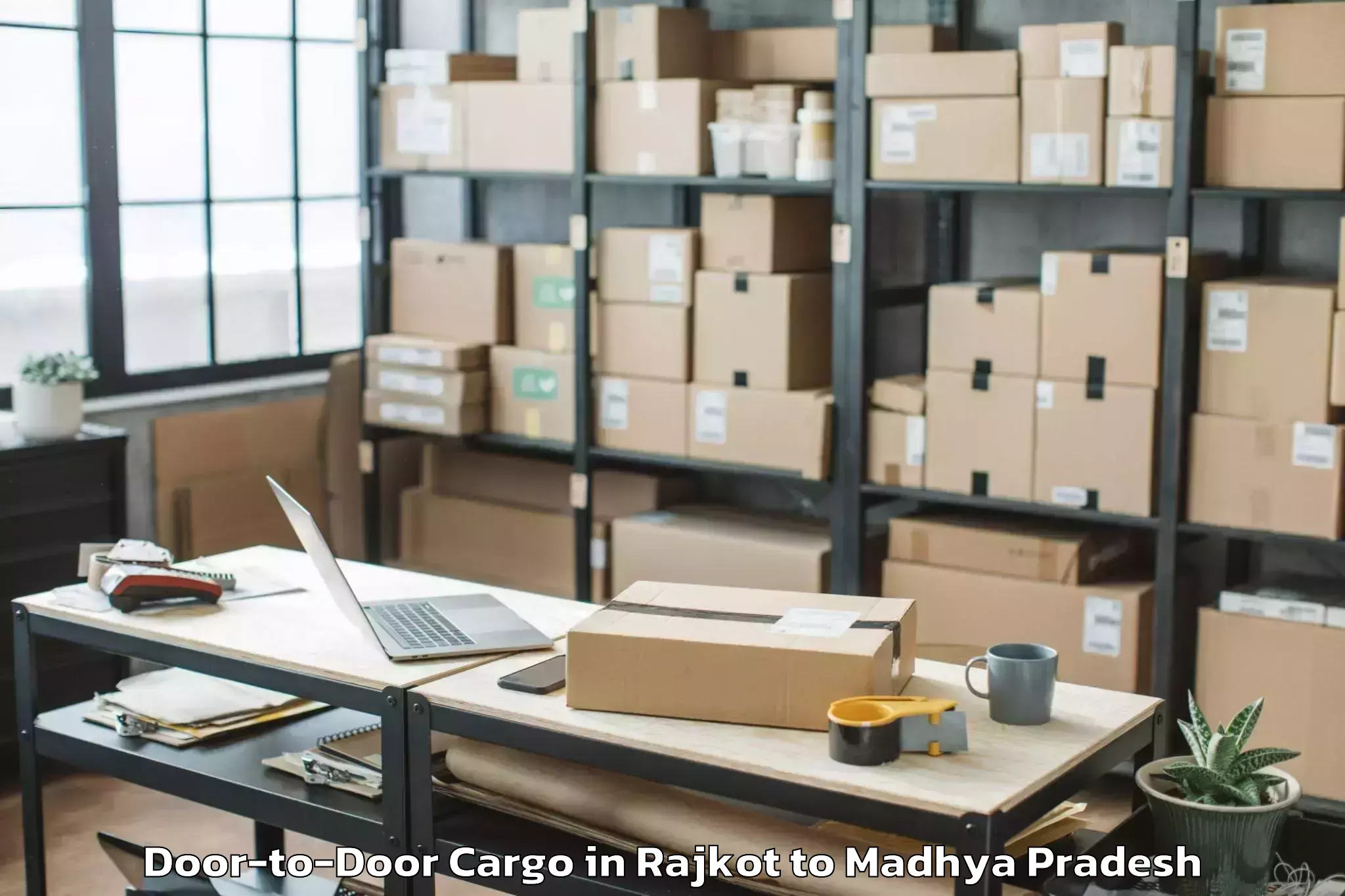 Reliable Rajkot to Shajapur Door To Door Cargo